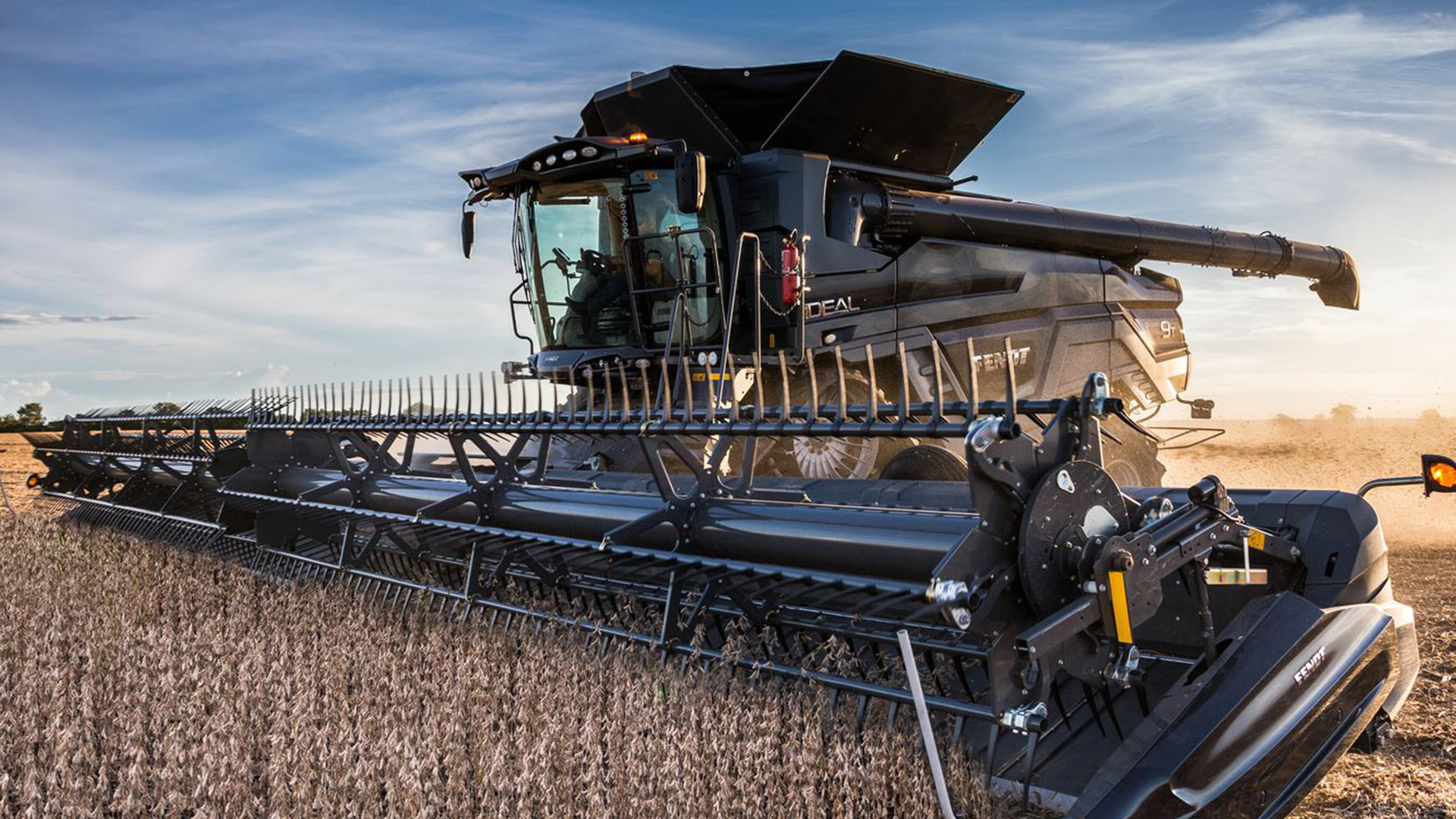 An AGCO tractor in a wheat field.