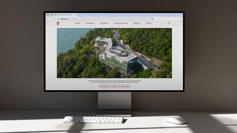 Computer displaying the homepage of the University of Chicago Global Campus Hong Kong website, designed by IfThen.