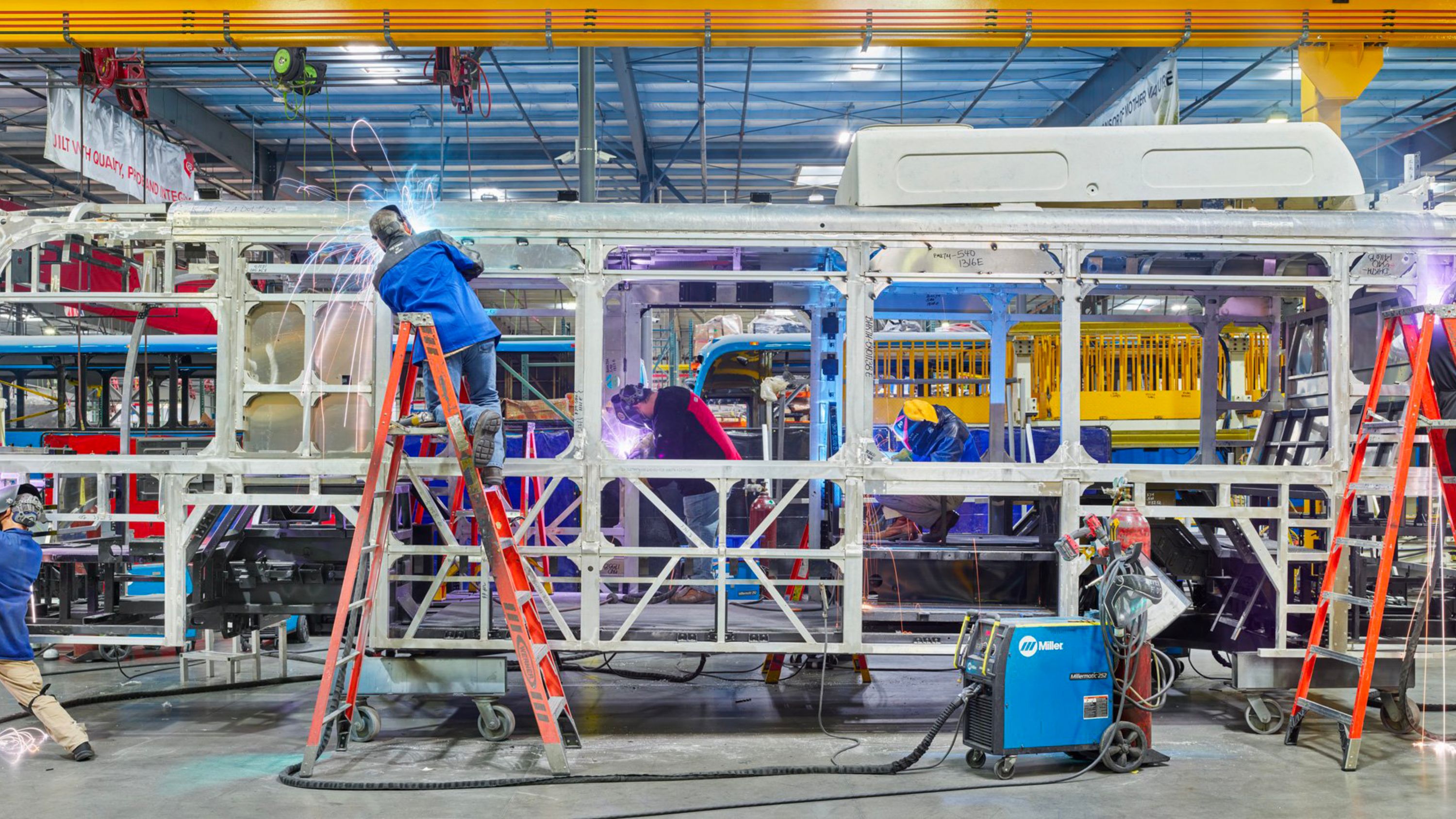 Workers assembling a metal frame