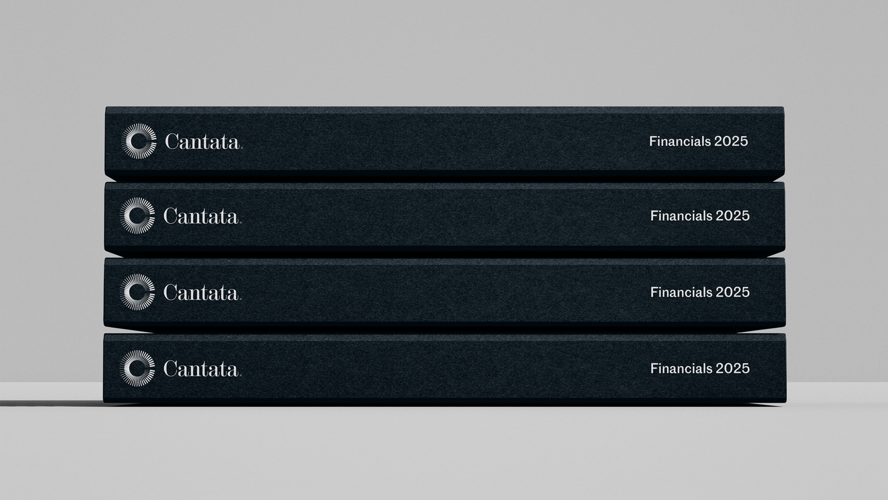 A stack of books with Cantata branding on the spine