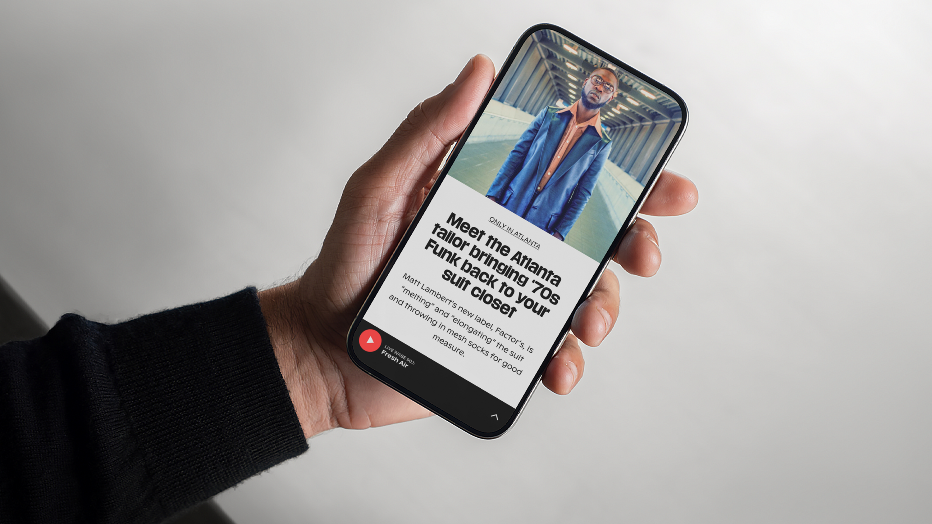 A person showing the WABE app.