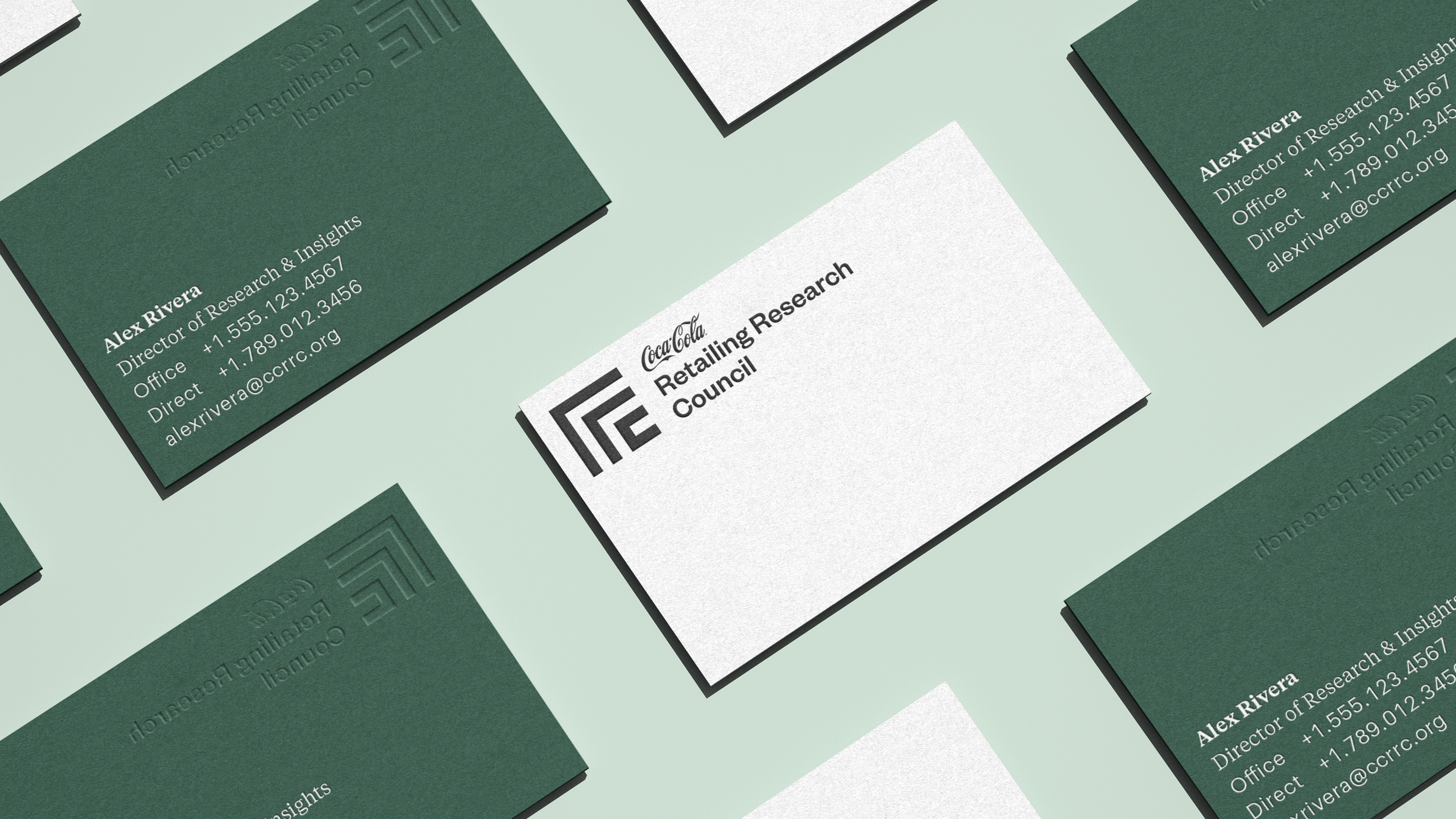 Business card applications for the Coca-Cola Retailing Research Council's updated brand identity system.