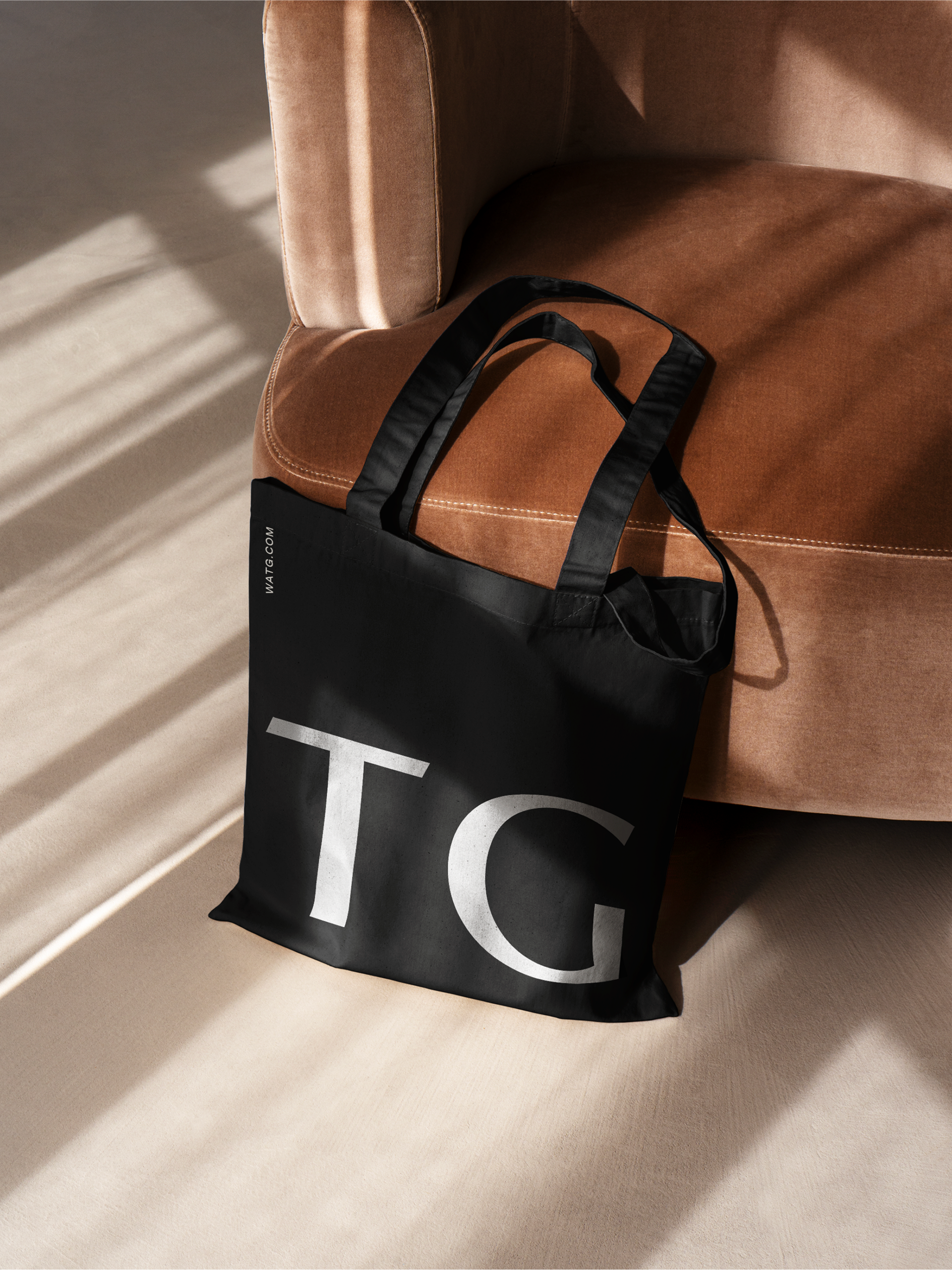 WATG tote against a chair